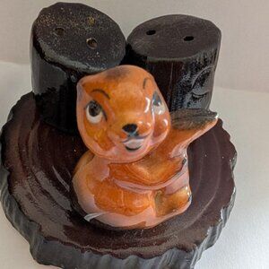Ceramic squirrel salt and pepper shaker set on tree stump base